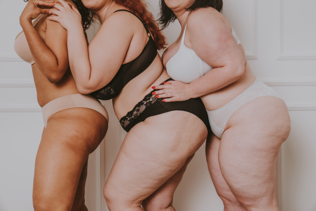 Three woman in their underwear in a line